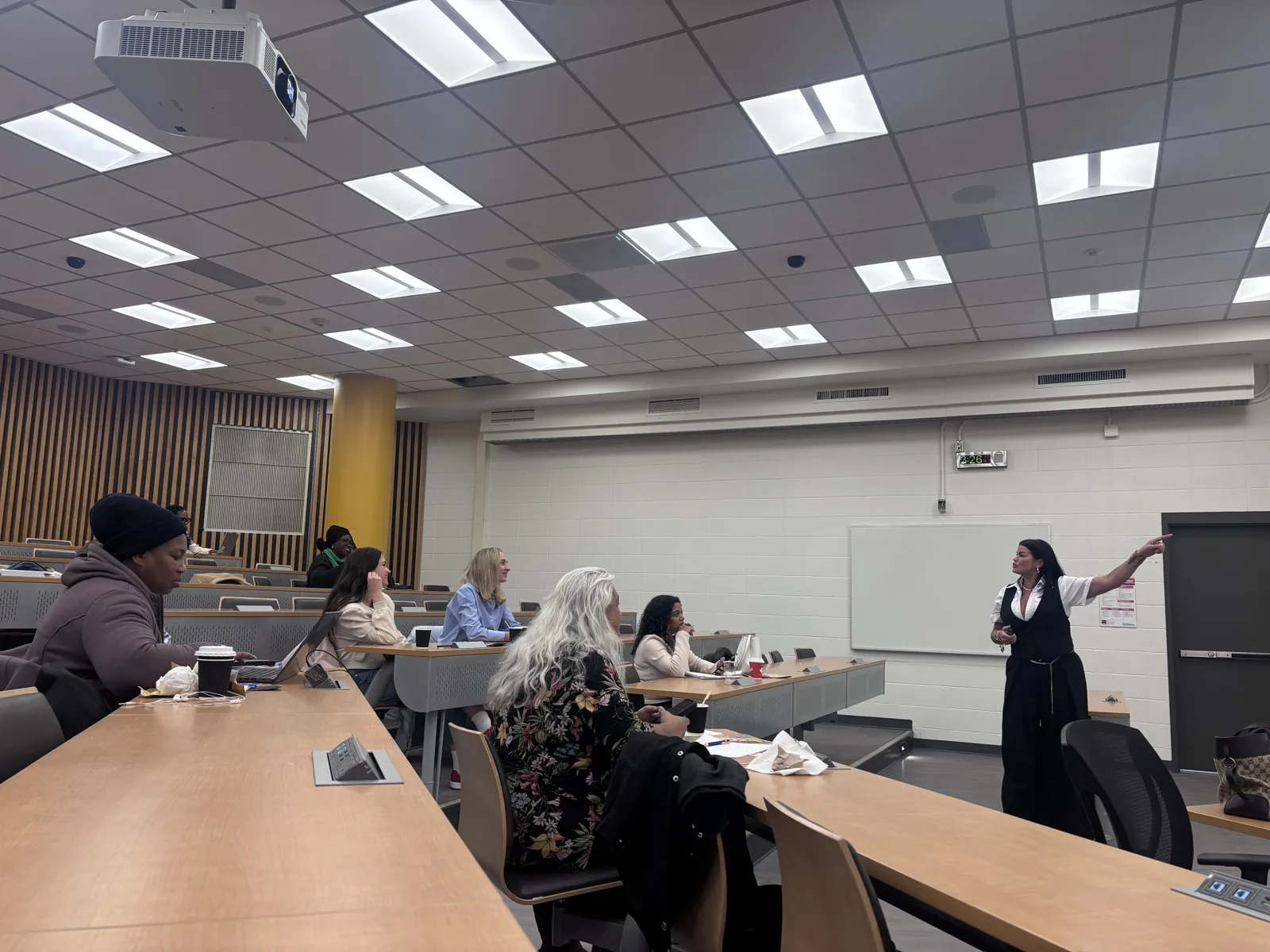 Tara speaking with participants during an in-person TecHer Forward session.